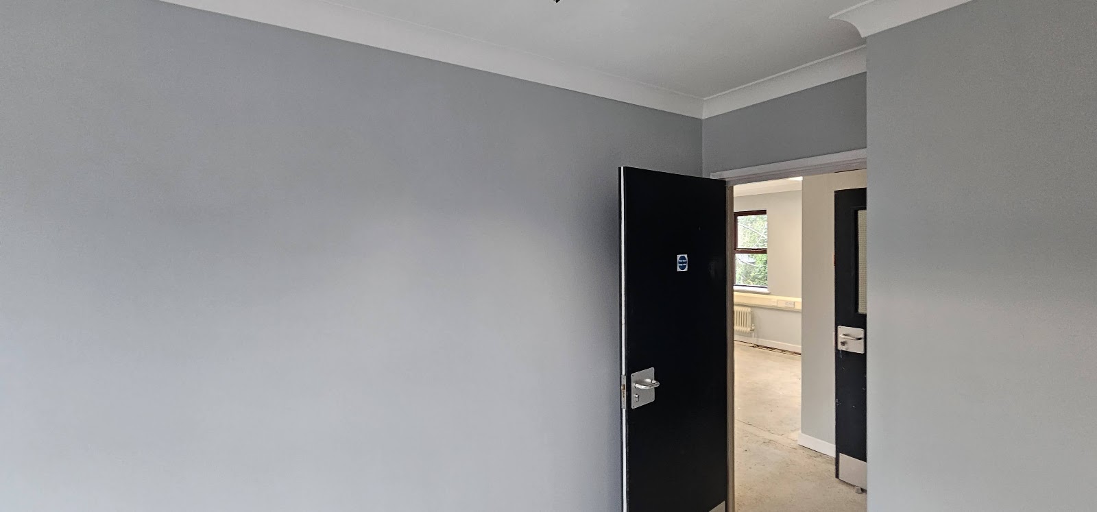 Grey walls with dark woodwork by H&C Cleaning and Maintenance in Hailsham