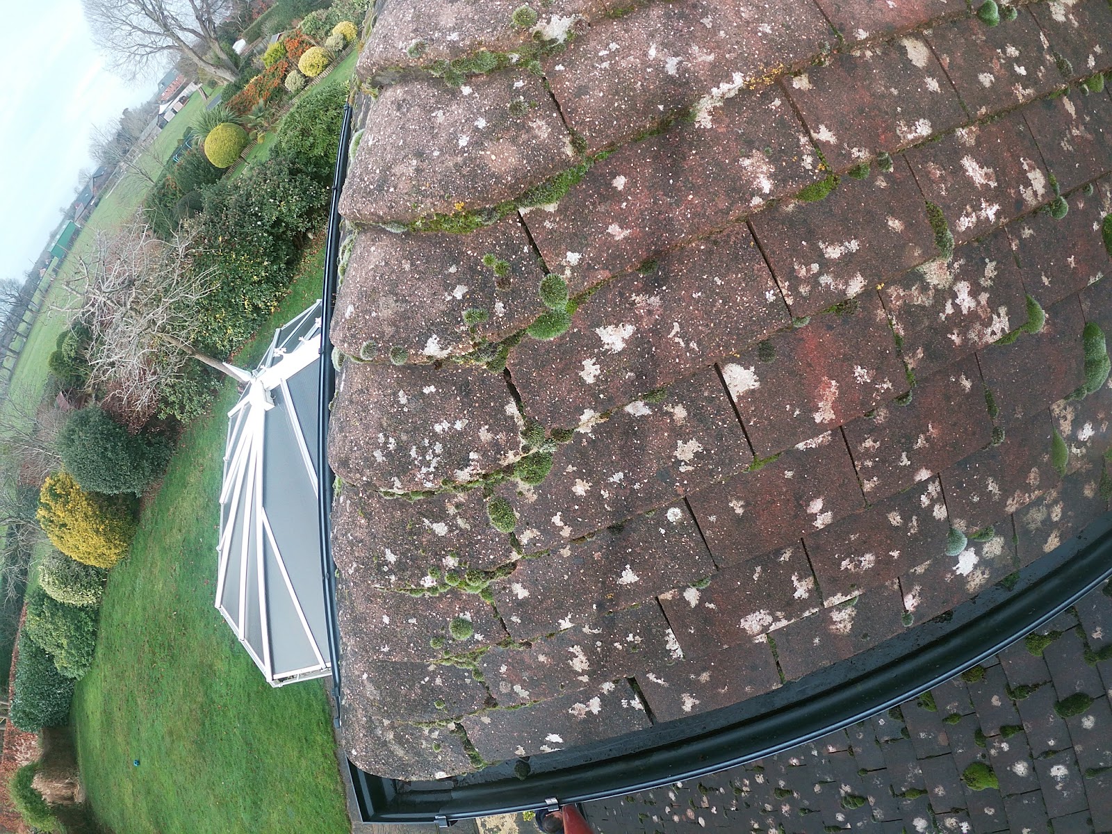 Gutter clearing over conservatory by H&C Cleaning and Maintenance in Hailsham