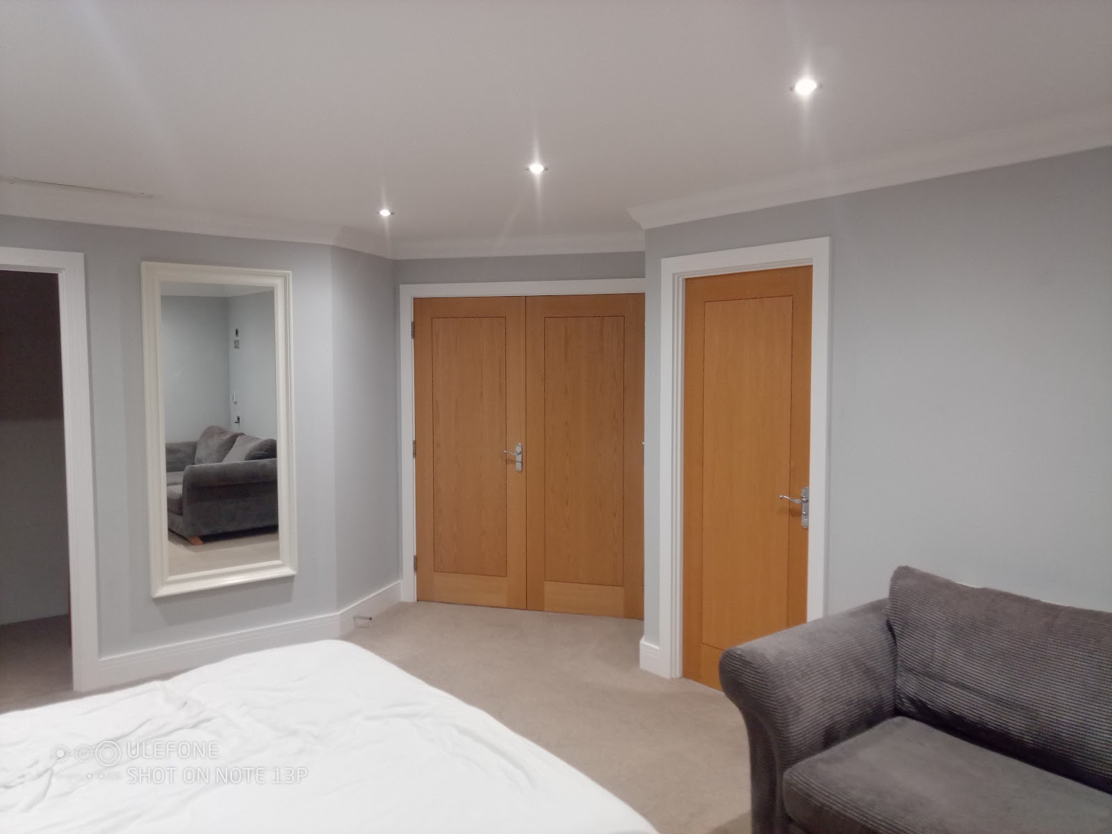 Bedroom with oak doors by H&C Cleaning and Maintenance in Hailsham